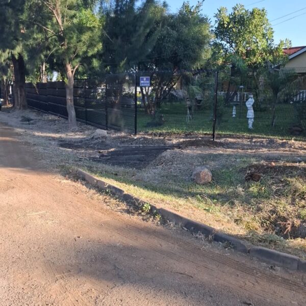 Black clearview mesh and slat security fence completed along a Norton property boundary